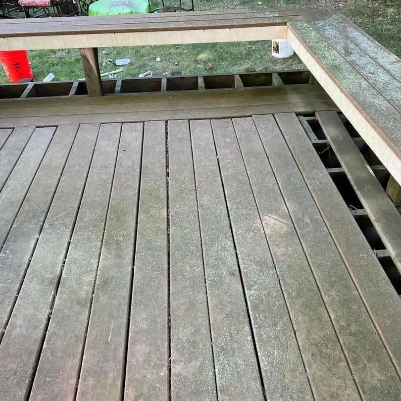 Composite decking with heavy moss infestation before cleaning