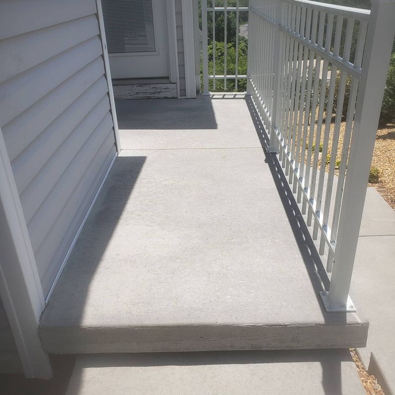 Same concrete porch landing restored after pressure washing