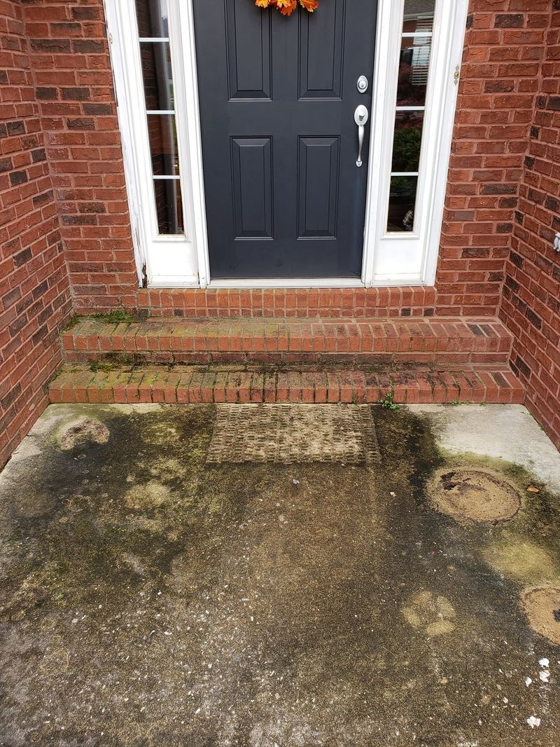 Brick porch with mildew and grime before pressure washing