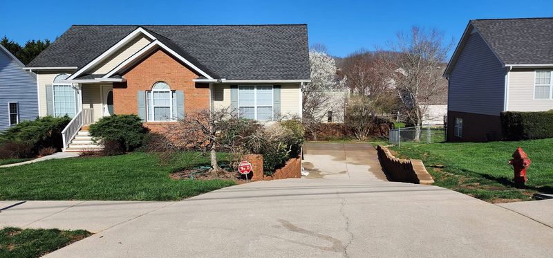 Same driveway swale cleaned after pressure washing