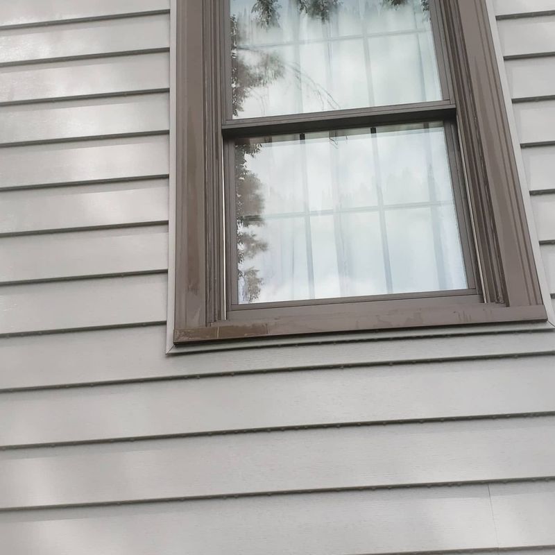 Same window trim and siding cleaned after soft washing