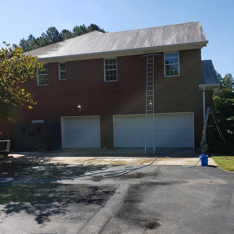 Same shingle roof after soft wash — streaks eliminated