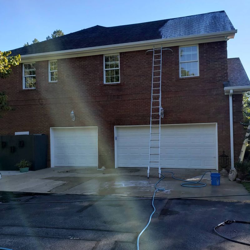 Roof soft wash setup on a streaked shingle roof before cleaning